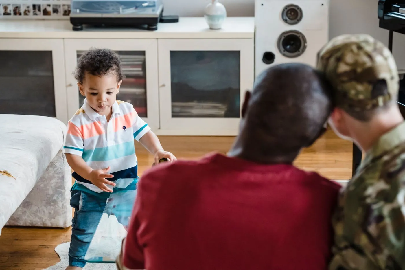 Parents spending time with their child at home.